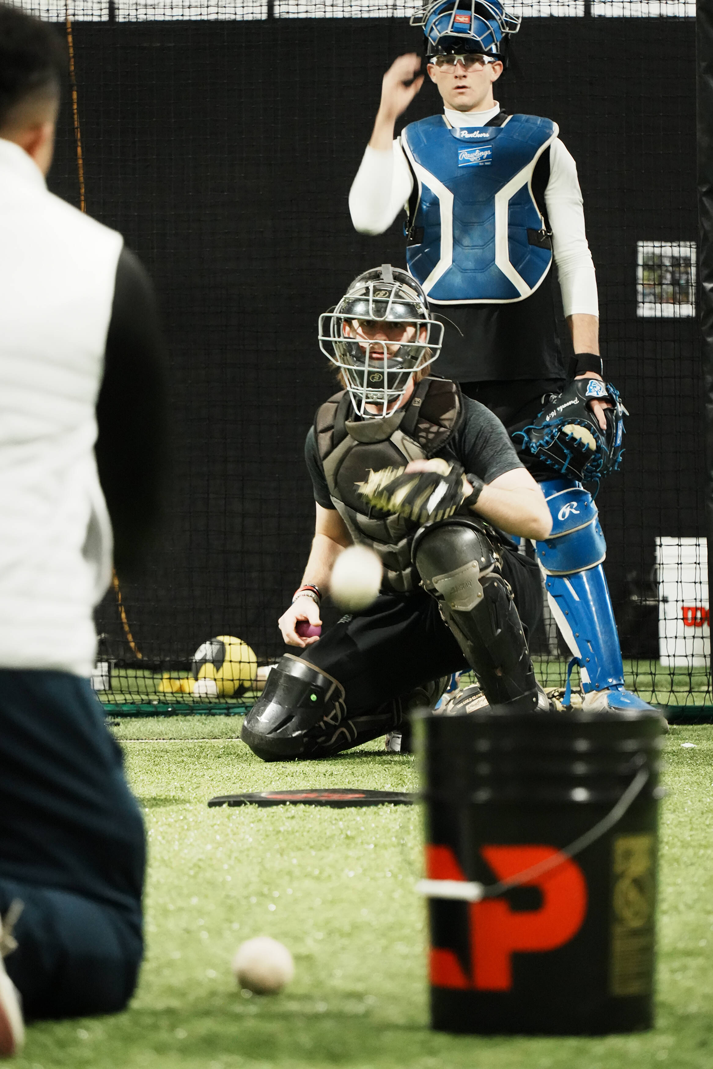 Catcher receiving a pitch during a CATCHPRO ACADEMY lesson